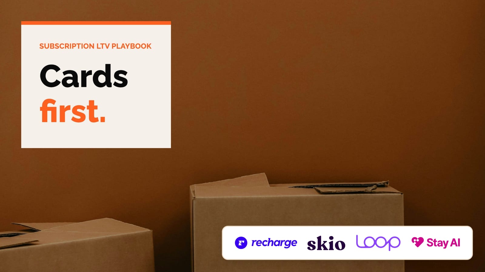 Two cardboard moving boxes against a plain brown wall